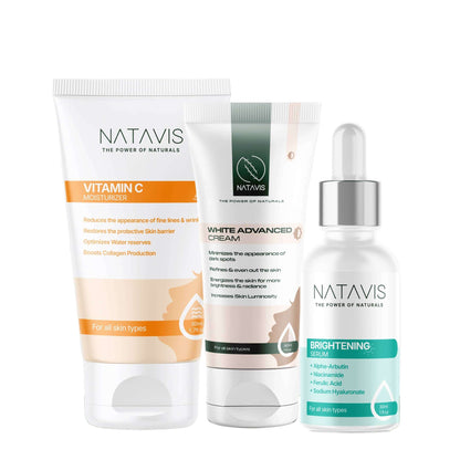 A skincare routine set from Natavis, including a Vitamin C Moisturizer, Brightening Serum, and White Advanced Cream, designed for dry skin to brighten dark spots and hyperpigmentation.