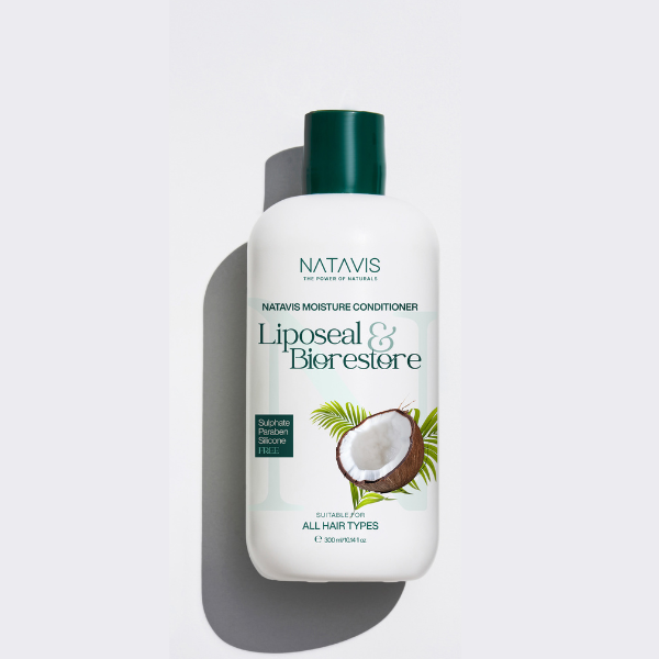 A bottle of Natavis Moisture Conditioner with the label showing the brand name, product name, and an image of a coconut. The bottle is white with a green cap.
